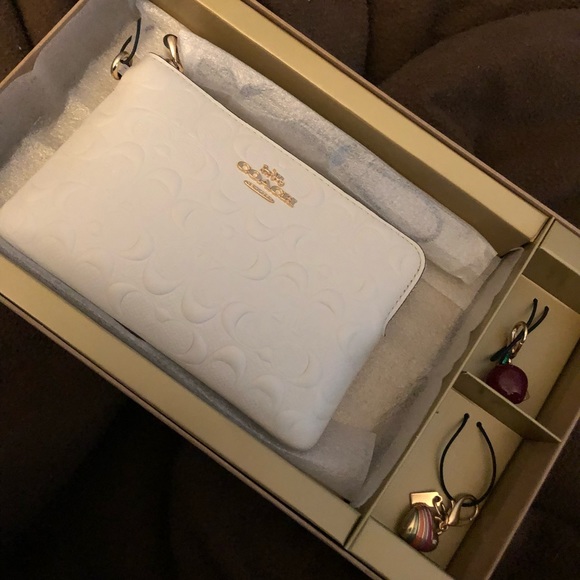 Coach Handbags - FLASH SALE!! NWT Coach adorable wristlet with charms!! Price FIRM